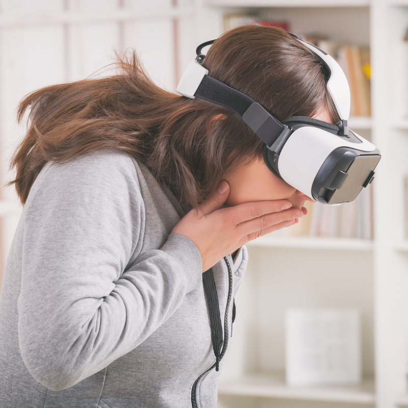Woman using virtual reality headset to fight her phobias or fears at home
